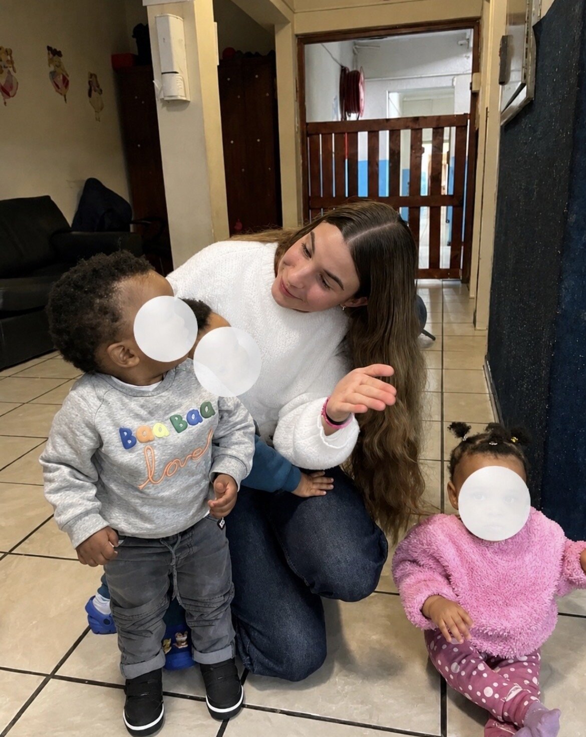 Leah spending time with children at the home
