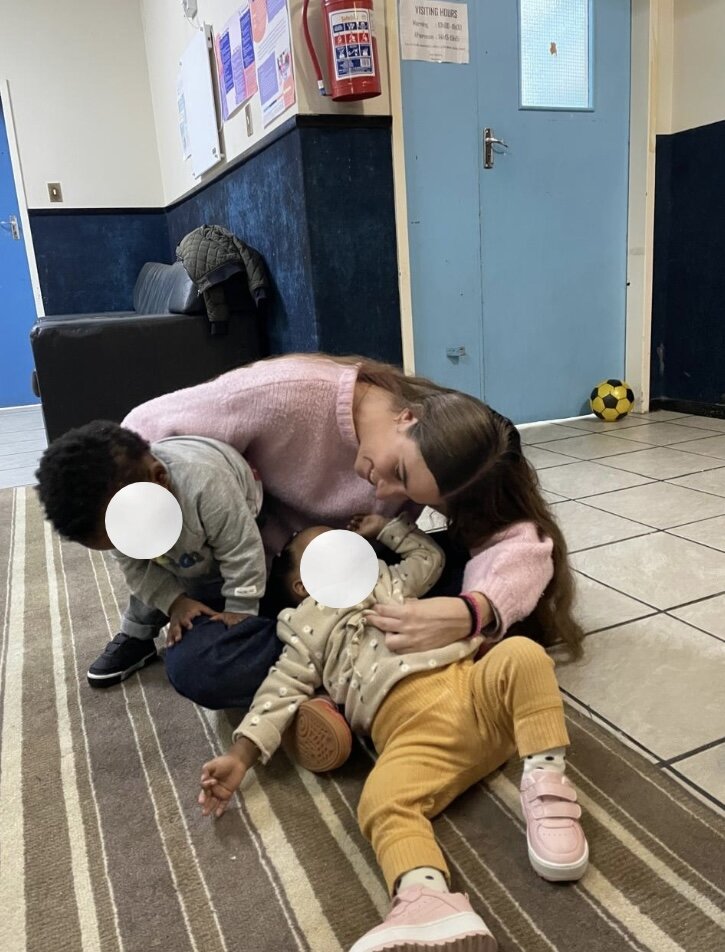 Leah spending time with children at Christine Revell Children's Home